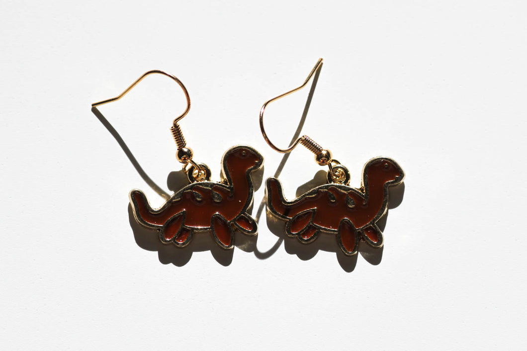 brown dinosaur charm earrings