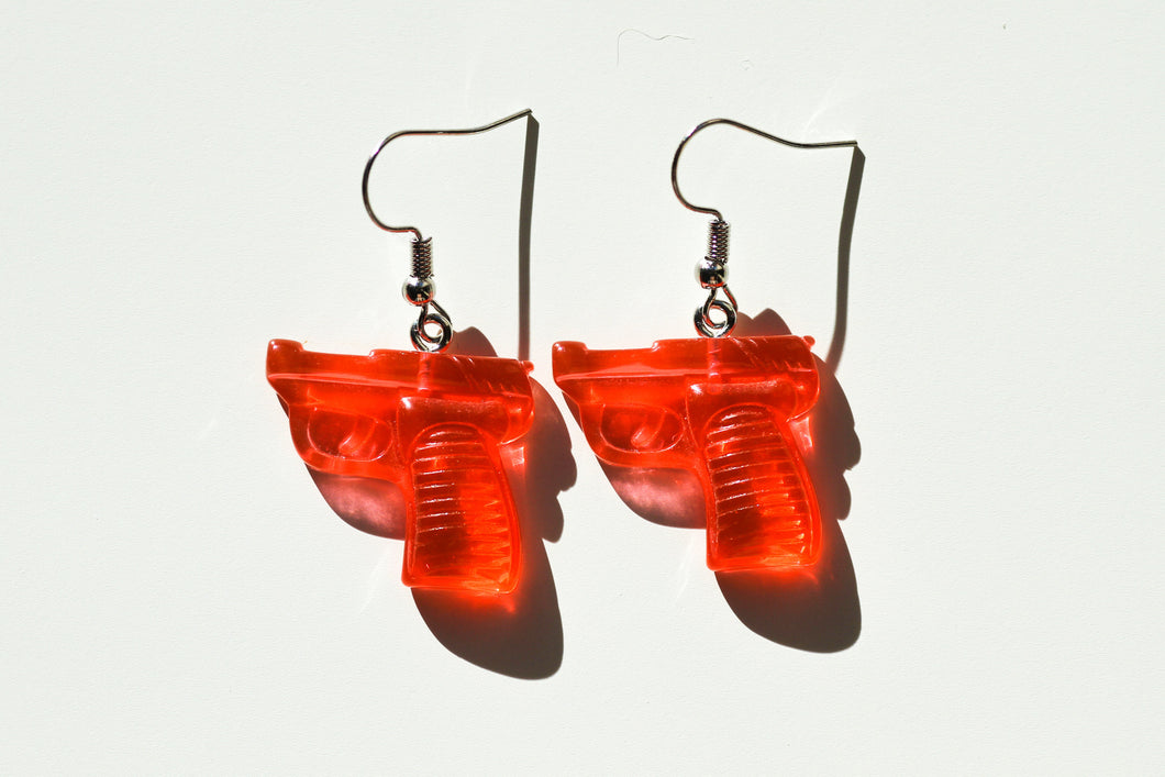 red pistol earrings